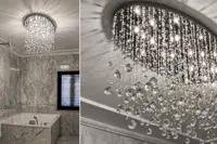 Moderne Deckenleuchte mit Kristallkugeln an Drähten in einem luxuriösen Marmorbad mit Badewanne und Detail der fallenden Kristalle